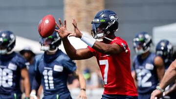 Seattle Seahawks quarterback Geno Smith (7) participates in a drill during training camp practice at Virginia Mason Athletic Center.