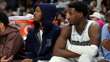 Jan 11, 2026; Memphis, Tennessee, USA; Memphis Grizzlies guard Ja Morant (left) and forward/center Jaren Jackson Jr. (right) looks on during the second quarter against the Brooklyn Nets at FedExForum. Mandatory Credit: Petre Thomas-Imagn Images