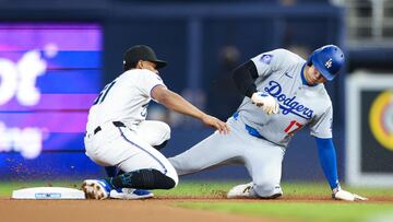MIAMI, FLORIDA - SEPTEMBER 18: Shohei Ohtani #17 of the Los Angeles Dodgers steals second base ahead of Otto Lopez #61 of the Miami Marlins during the first inning at loanDepot park on September 18, 2024 in Miami, Florida. Carmen Mandato/Getty Images/AFP (Photo by Carmen Mandato / GETTY IMAGES NORTH AMERICA / Getty Images via AFP)