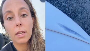 Ariane Ochoa mostrando su tabla de surf atravesada por la punta.