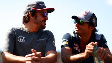 BAKU, AZERBAIJAN - JUNE 25: Fernando Alonso of Spain and McLaren Honda and Carlos Sainz of Spain and Scuderia Toro Rosso talk on the Drivers Parade before the Azerbaijan Formula One Grand Prix at Baku City Circuit on June 25, 2017 in Baku, Azerbaijan. (Photo by Dan Istitene/Getty Images)