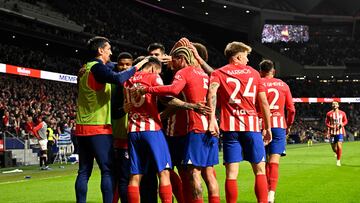 Atletico Madrid's Dutch forward #09 Memphis Depay (not seen) celebrates scoring his team's first goal with teammates during the Spanish Copa del Rey (King's Cup) quarter final football match between Club Atletico de Madrid and Sevilla FC at the Metropolitano stadium in Madrid on January 25, 2024. (Photo by JAVIER SORIANO / AFP)