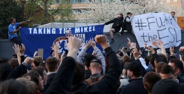 Football supporters demonstrate against the proposed European Super League outside of Stamford Bridge football stadium in London on April 20, 2021, ahead of the English Premier League match between Chelsea and Brighton and Hove Albion. -