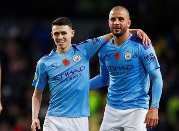 Manchester City's Kyle Walker and Phil Foden celebrate