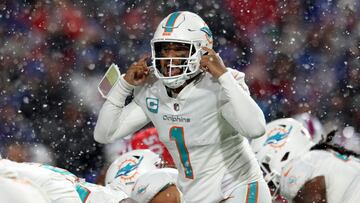 ORCHARD PARK, NEW YORK - DECEMBER 17: Tua Tagovailoa #1 of the Miami Dolphins signals at the line of scrimmage against the Buffalo Bills during the fourth quarter at Highmark Stadium on December 17, 2022 in Orchard Park, New York.   Bryan M. Bennett/Getty Images/AFP (Photo by Bryan M. Bennett / GETTY IMAGES NORTH AMERICA / Getty Images via AFP)