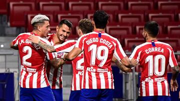 Atletico Madrid's Spanish midfielder Vitolo (2L) celebrates with teammates after scoring during the Spanish League football match between Atletico Madrid and Real Valladolid at the Wanda Metropolitan stadium in Madrid on June 20, 2020. (Photo by JAVI
