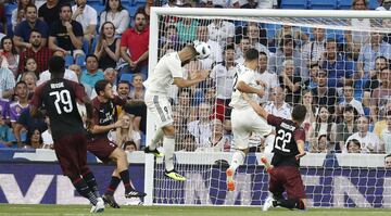 Karim Benzema (centre) heads Real Madrid into a second-minute lead.