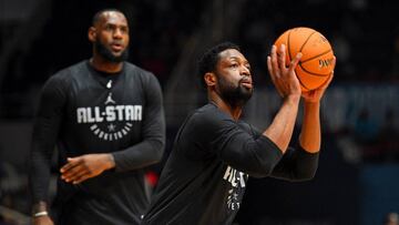 Feb 16, 2019; Charlotte, NC, USA; Team Lebron guard Dwayne Wade of the Miami Heat (3) shoots the ball as Team Lebron forward Lebron James of the Los Angeles Lakers (23) watches during NBA All-Star Game practice at the Bojangles Coliseum. Mandatory Credit: