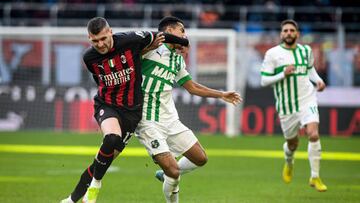 MILAN, ITALY - JANUARY 29: Ante Rebic of AC Milan and RogÃ©rio of Sassuolo fight for the ball during the Italian Serie A football match AC Milan vs Sassuolo at San Siro stadium in Milan, Italy on January 29, 2023 (Photo by Piero Cruciatti/Anadolu Agency via Getty Images)