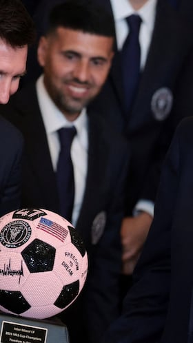 U.S. President Donald Trump is gifted a jewelled soccer ball with his signature on it from Inter Miami CF captain Lionel Messi, on the day he honors reigning Major League Soccer (MLS) champion Inter Miami CF players and team officials with an event in the East Room of the White House in Washington, D.C., U.S., March 5, 2026. REUTERS/Jonathan Ernst