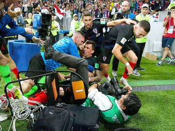 MOSCOW, RUSSIA - JULY 11:  Croatia players knock over a photograper as they celebrate after Mario Mandzukic of Croatia scores their team&#039;s second goal during the 2018 FIFA World Cup Russia Semi Final match between England and Croatia at Luzhniki Stadium on July 11, 2018 in Moscow, Russia.  (Photo by Dan Mullan/Getty Images)