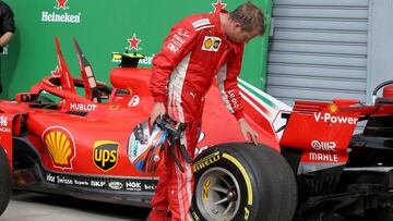 MONZA, ITALY - SEPTEMBER 02: Second placed Kimi Raikkonen of Finland and Ferrari inspects his car in parc ferme during the Formula One Grand Prix of Italy at Autodromo di Monza on September 2, 2018 in Monza, Italy. (Photo by Charles Coates/Getty Images)