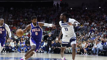 Oct 11, 2024; Des Moines, Iowa, USA; Minnesota Timberwolves center Naz Reid (11) defends Philadelphia 76ers forward Paul George (8) at Wells Fargo Arena. Mandatory Credit: Reese Strickland-Imagn Images