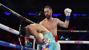 NEW YORK, NEW YORK - DECEMBER 10: Sandor Martin punches Teofimo Lopez during their junior welterweight bout at Madison Square Garden on December 10, 2022 in New York City.   Al Bello/Getty Images/AFP (Photo by AL BELLO / GETTY IMAGES NORTH AMERICA / Getty Images via AFP)