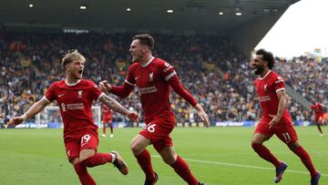 Liverpool's Scottish defender #26 Andrew Robertson (R) celebrates with Liverpool's English midfielder #19 Harvey Elliott (L) after scoring their second goal during the English Premier League football match between Wolverhampton Wanderers and Liverpool at the Molineux stadium in Wolverhampton, central England on September 16, 2023. (Photo by Adrian DENNIS / AFP) / RESTRICTED TO EDITORIAL USE. No use with unauthorized audio, video, data, fixture lists, club/league logos or 'live' services. Online in-match use limited to 120 images. An additional 40 images may be used in extra time. No video emulation. Social media in-match use limited to 120 images. An additional 40 images may be used in extra time. No use in betting publications, games or single club/league/player publications. / 