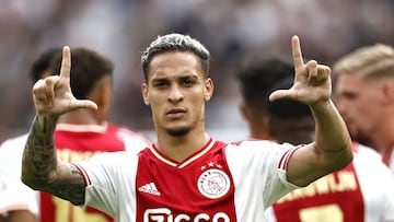 Ajax's Brazilian midfielder Antony Matheus Dos Santos celebrates after socring the 2-1 goal during the Dutch Eredivisie match between Ajax Amsterdam and FC Groningen at the Johan Cruijff ArenA in Amsterdam, on August 14, 2022. (Photo by MAURICE VAN STEEN / ANP / AFP) / Netherlands OUT