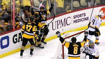 PITTSBURGH, PA - MAY 29: Nick Bonino #13 of the Pittsburgh Penguins celebrates a goal during the first period with teammates in Game One of the 2017 NHL Stanley Cup Final against the Nashville Predators at PPG Paints Arena on May 29, 2017 in Pittsburgh, Pennsylvania.   Matt Kincaid/Getty Images/AFP
 == FOR NEWSPAPERS, INTERNET, TELCOS &amp; TELEVISION USE ONLY ==