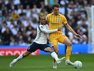 Tottenham Hotspur's Dutch midfielder #07 Xavi Simons (L) vies with Brighton's Dutch defender #27 Mats Wieffer (R) during the English Premier League football match between Tottenham Hotspur and Brighton and Hove Albion at the Tottenham Hotspur Stadium in London, on April 18, 2026. (Photo by Ben STANSALL / AFP) / RESTRICTED TO EDITORIAL USE. No use with unauthorized audio, video, data, fixture lists, club/league logos or 'live' services. Online in-match use limited to 120 images. An additional 40 images may be used in extra time. No video emulation. Social media in-match use limited to 120 images. An additional 40 images may be used in extra time. No use in betting publications, games or single club/league/player publications. /