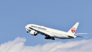 Tokyo, Japan - April 18, 2021:Japan Airlines (JAL) Boeing B777-200ER (JA703J) passenger plane.