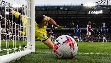 Aston Villa's Argentinian goalkeeper Emiliano Martinez jumps for the ball during the English Premier League football match between Chelsea and Aston Villa at Stamford Bridge in London on April 1, 2023. (Photo by JUSTIN TALLIS / AFP) / RESTRICTED TO EDITORIAL USE. No use with unauthorized audio, video, data, fixture lists, club/league logos or 'live' services. Online in-match use limited to 120 images. An additional 40 images may be used in extra time. No video emulation. Social media in-match use limited to 120 images. An additional 40 images may be used in extra time. No use in betting publications, games or single club/league/player publications. / 