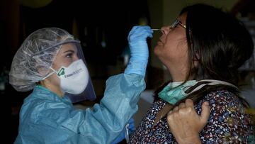 Laura nurse from Osakidetza in a Biscayan home performing a PCR test on a patient with symptoms of Covid-19. These tests detect the coronavirus RNA and are analyzed in Microbiology at the Hospital de Cruces. Lezama, Vizcaya ,Spain, 18/04/2020. 