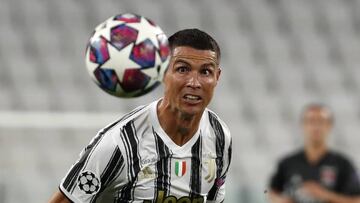 FILE - In this Aug. 7, 2020 file photo, Juventus' Cristiano Ronaldo eyes the ball during the Champions League round of 16 second leg, soccer match between Juventus and Lyon at the Allianz stadium in Turin, Italy. With the new Serie A season set to be