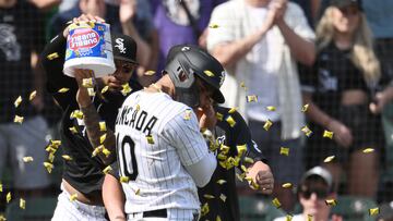 CHICAGO, ILLINOIS - JUNE 03: Yoan Moncada #10 of the Chicago White Sox is doused with Dubble Bubble gum after scoring in the 10th inning against the Detroit Tigers at Guaranteed Rate Field on June 03, 2023 in Chicago, Illinois.   Quinn Harris/Getty Images/AFP (Photo by Quinn Harris / GETTY IMAGES NORTH AMERICA / Getty Images via AFP)