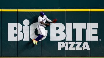 ARLINGTON, TEXAS - OCTOBER 27: Adolis Garc�a #53 of the Texas Rangers hits the wall after making a catch in the ninth inning against the Arizona Diamondbacks during Game One of the World Series at Globe Life Field on October 27, 2023 in Arlington, Texas.   Carmen Mandato/Getty Images/AFP (Photo by Carmen Mandato / GETTY IMAGES NORTH AMERICA / Getty Images via AFP)