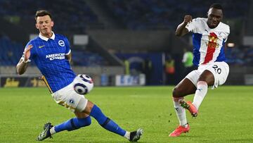 Crystal Palace&#039;s Zaire-born Belgian striker Christian Benteke (R) shoots but fails to score during the English Premier League football match between Brighton and Hove Albion and Crystal Palace at the American Express Community Stadium in Brighton, so