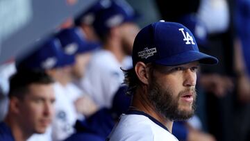 LOS ANGELES, CALIFORNIA - OCTOBER 12: Clayton Kershaw #22 of the Los Angeles Dodgers looks on from the dugout before game two of the National League Division Series against the San Diego Padres at Dodger Stadium on October 12, 2022 in Los Angeles, California.   Harry How/Getty Images/AFP