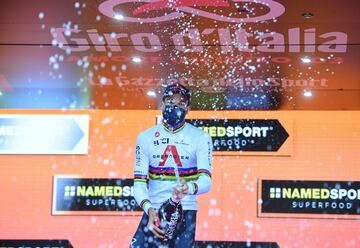 Cycling - Giro d'Italia - Stage 21 - Cernusco sul Naviglio to Milan, Italy - October 25, 2020 UCI WorldTeam Ineos Grenadiers' Filippo Ganna celebrates on the podium with sparkling wine after winning Stage 21 REUTERS/Stringer