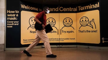 NEW YORK CITY - JULY 27: A person wears a mask while walking in Grand Central Terminal on July 27, 2021 in New York City. Due to the rapidly spreading Delta variant, the Centers for Disease Control and Prevention (CDC) has recommendedthat fully vaccinated