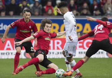 (L-R) Freiburg's defender Robin Koch, Turkish defender Caglar Soeyuencue, Leverkusen's defender Benjamin Henrichs and Freiburg's forward Tim Kleindienst vie for the ball during the German first division Bundesliga football match SC Freiburg versus Bayer L