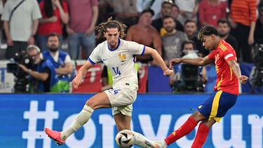 Spain's forward #19 Lamine Yamal shoots to score his team's first goal during the UEFA Euro 2024 semi-final football match between Spain and France at the Munich Football Arena in Munich on July 9, 2024. (Photo by MIGUEL MEDINA / AFP)