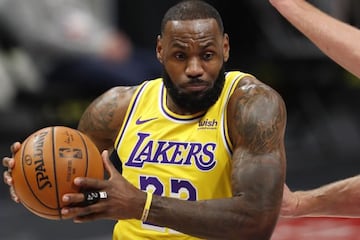 Jan 28, 2021; Detroit, Michigan, USA; Los Angeles Lakers forward LeBron James (23) goes up for a shot against Detroit Pistons center Mason Plumlee (24) during the first quarter at Little Caesars Arena. Mandatory Credit: Raj Mehta-USA TODAY Sports