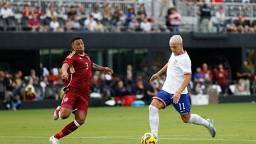 US forward #11 Matko Miljevic shoots on goal as Venezuelan defender #3 Anthony Graterol tries to block the shot during the USA against Venezuela international friendly at Chase Stadium in Fort Lauderdale, Florida, on January 18, 2025. (Photo by Chris Arjoon / AFP)