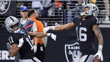 LAS VEGAS, NEVADA - JANUARY 07: Wide receivers Tre Tucker #11 and Jakobi Meyers #16 of the Las Vegas Raiders celebrate Meyers' 33-yard touchdown against the Denver Broncos in the fourth quarter of their game at Allegiant Stadium on January 07, 2024 in Las Vegas, Nevada. The Raiders defeated the Broncos 27-14.   Ethan Miller/Getty Images/AFP (Photo by Ethan Miller / GETTY IMAGES NORTH AMERICA / Getty Images via AFP)