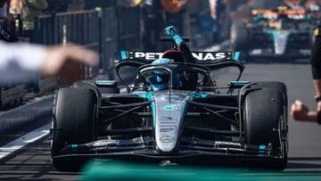 Mercedes' British driver George Russell celebrates in his car after winning the Formula One Belgian Grand Prix at the Spa-Francorchamps Circuit in Spa on July 28, 2024. Lewis Hamilton emerged as the winner of a dramatic Belgian Grand Prix on July 28, 2024 after Mercedes teammate George Russell, who took the chequered flag, was disqualified when his car was found to be underweight following the race. (Photo by Simon Wohlfahrt / AFP)