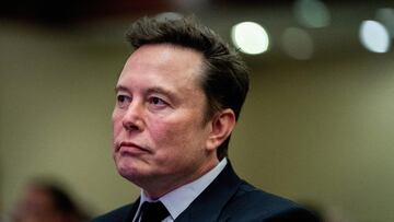 FILE PHOTO: Tesla CEO and X owner Elon Musk listens as US President-elect Donald Trump speaks during a meeting with House Republicans at the Hyatt Regency hotel in Washington, DC, U.S. on November 13, 2024. ALLISON ROBBERT/Pool via REUTERS/File Photo