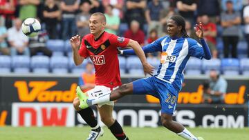 WIGAN, ENGLAND - AUGUST 22: Nemanja Vidic of Manchester United clashes with Hugo Rodallega of Wigan Athletic during the FA Barclays Premier League match between Wigan Athletic and Manchester United at DW Stadium on August 22 2009 in Wigan, England. (Photo by Matthew Peters/Manchester United via Getty Images)