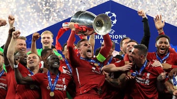 UEFA Champions League - Tottenham Hotspur vs Liverpool
 
 01 June 2019, Spain, Madrid: Liverpool players celebrate with the UEFA Champions League Trophy after the UEFA&nbsp;Champions League final soccer match between Tottenham Hotspur and Liverpool at Wan