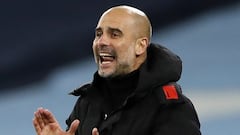 Manchester City&#039;s Spanish manager Pep Guardiola reacts during the English Premier League football match between Manchester City and West Bromwich Albion at the Etihad Stadium in Manchester, north west England, on December 15, 2020. (Photo by Clive Br