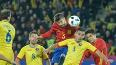 Spains defender Gerard Pique and Romanias defender Ovidiu Stefan Hoban vie for the ball during the friendly football match between Romania and Spain in Cluj Napoca, Romania