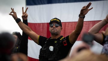 A man gestures the OK sign that is now seen as a symbol of white supremacy, as hundreds gathered during a Proud Boys rally at Delta Park in Portland, Oregon on September 26, 2020.