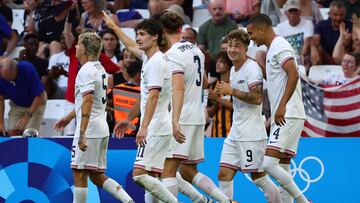 US' forward #11 Paxten Aaronson celebrates with teammates after scoring his team's fourth goal the men's group A football match between New Zealand and the USA during the Paris 2024 Olympic Games at the Marseille Stadium in Marseille on July 27, 2024. (Photo by Clement MAHOUDEAU / AFP)