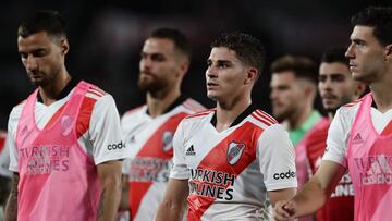 River Plate's footballers leave the field after a 2-2 draw against Racing in the Argentine Professional Football League match at El Monumental stadium in Buenos Aires, on February 27, 2022.  The match ended in a 2-2 draw. (Photo by ALEJANDRO PAGNI / AFP)