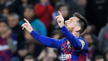 Barcelona's Argentine forward Lionel Messi celebrates after scoring during the Spanish league football match FC Barcelona against Deportivo Alaves at the Camp Nou stadium in Barcelona on December 21, 2019. (Photo by LLUIS GENE / AFP)