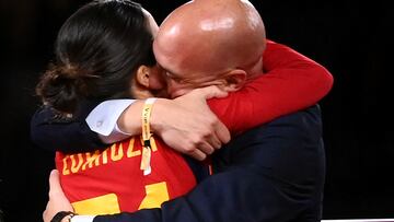 Spain's midfielder Claudia Zornoza #21 is congratuled by President of the Royal Spanish Football Federation Luis Rubiales (R) after winning the Australia and New Zealand 2023 Women's World Cup final football match between Spain and England at Stadium Australia in Sydney on August 20, 2023. The Spanish football federation (RFEF) on August 26, 2023 threatened to take legal action over Women's World Cup player Jenni Hermoso's "lies" about her kiss with its president Luis Rubiales. (Photo by FRANCK FIFE / AFP)