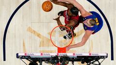 Jun 1, 2023; Denver, CO, USA; Miami Heat forward Jimmy Butler (22) battles for the ball against Denver Nuggets center Nikola Jokic (15) during the first half in game one of the 2023 NBA Finals at Ball Arena. Mandatory Credit: Jack Dempsey/Pool Photo-USA TODAY Sports