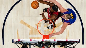 Jun 1, 2023; Denver, CO, USA; Miami Heat forward Jimmy Butler (22) battles for the ball against Denver Nuggets center Nikola Jokic (15) during the first half in game one of the 2023 NBA Finals at Ball Arena. Mandatory Credit: Jack Dempsey/Pool Photo-USA TODAY Sports